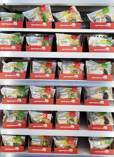 mmmpanadas lined up on store shelves